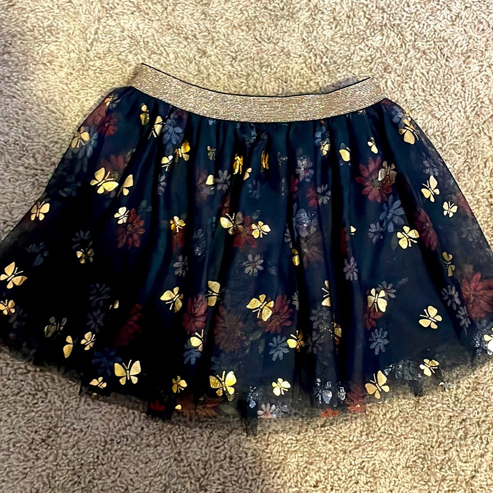 Girls skort. Gold butterfly pattern. Navy